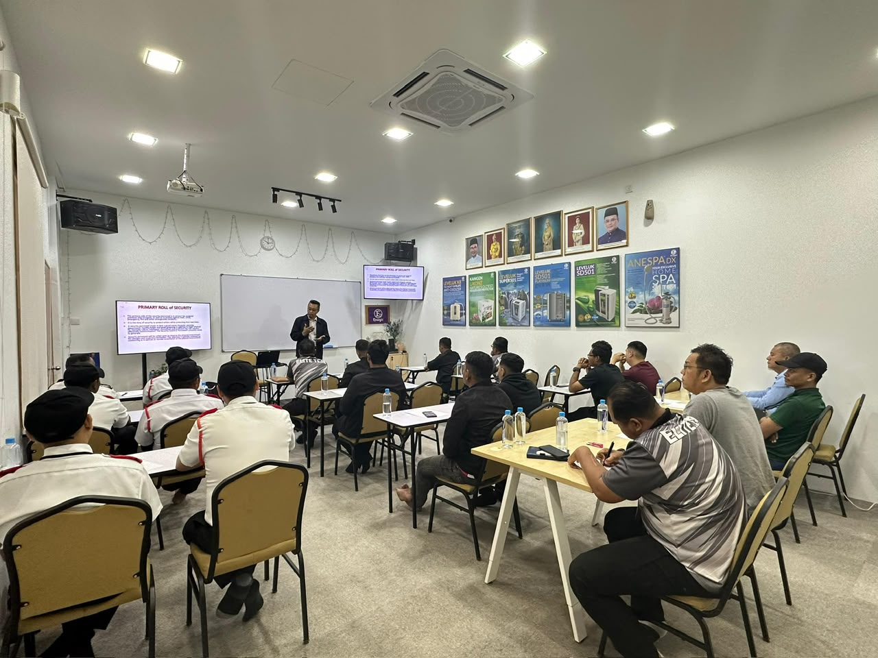 HRD Corp certified trainer delivering a Primary Role of Security session to seated participants in a Top Gun Consultancy classroom